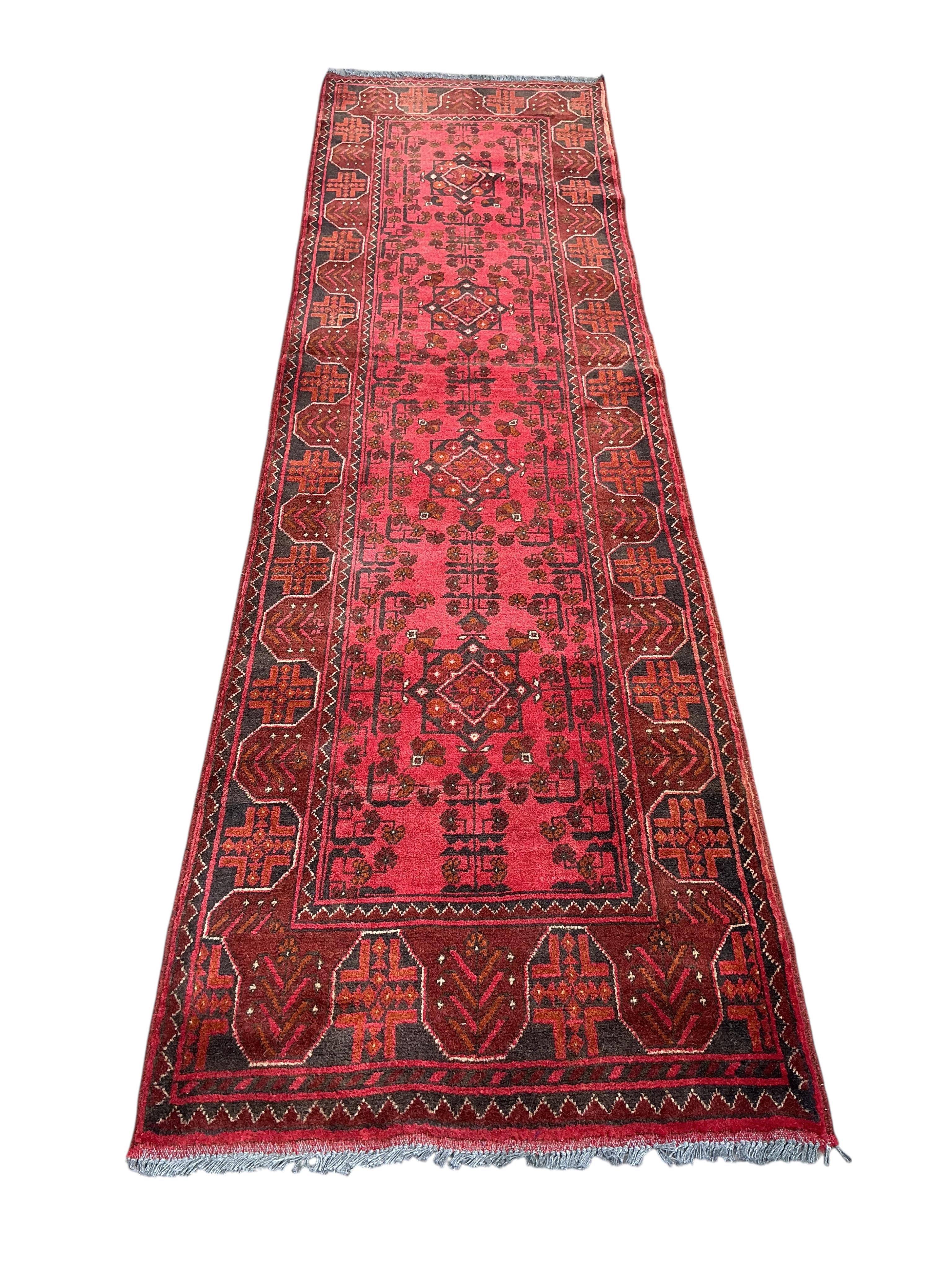 An Afghan runner, 285 x 80cm